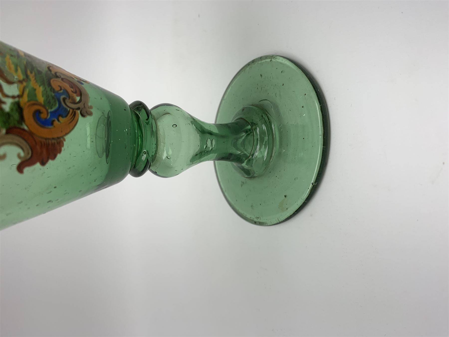 19th century bohemian green glass wine glass, the funnel bowl decorated in enamells with a Historismus hunting scene in the manner of Egermann & Lobmeyr, upon a baluster stem and circular foot, H14.5cm