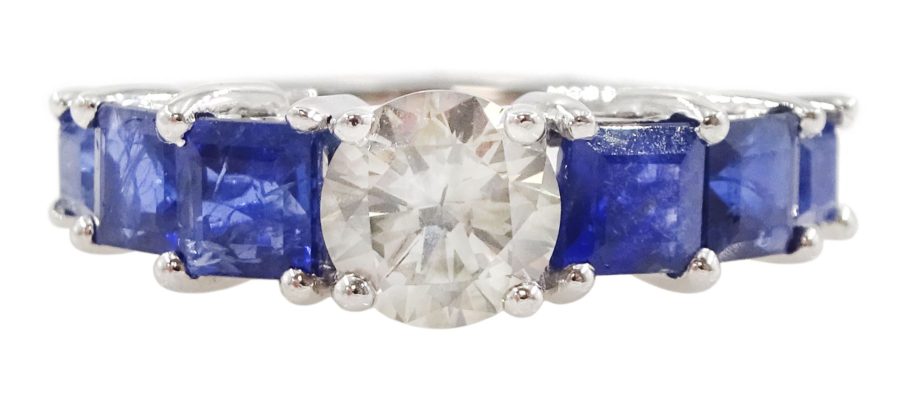 Platinum seven stone diamond and sapphire ring, the principal round brilliant cut diamond of approx 0.70 carat, with three princess cut sapphires set either side, hallmarked, total sapphire weight approx 1.95 carat