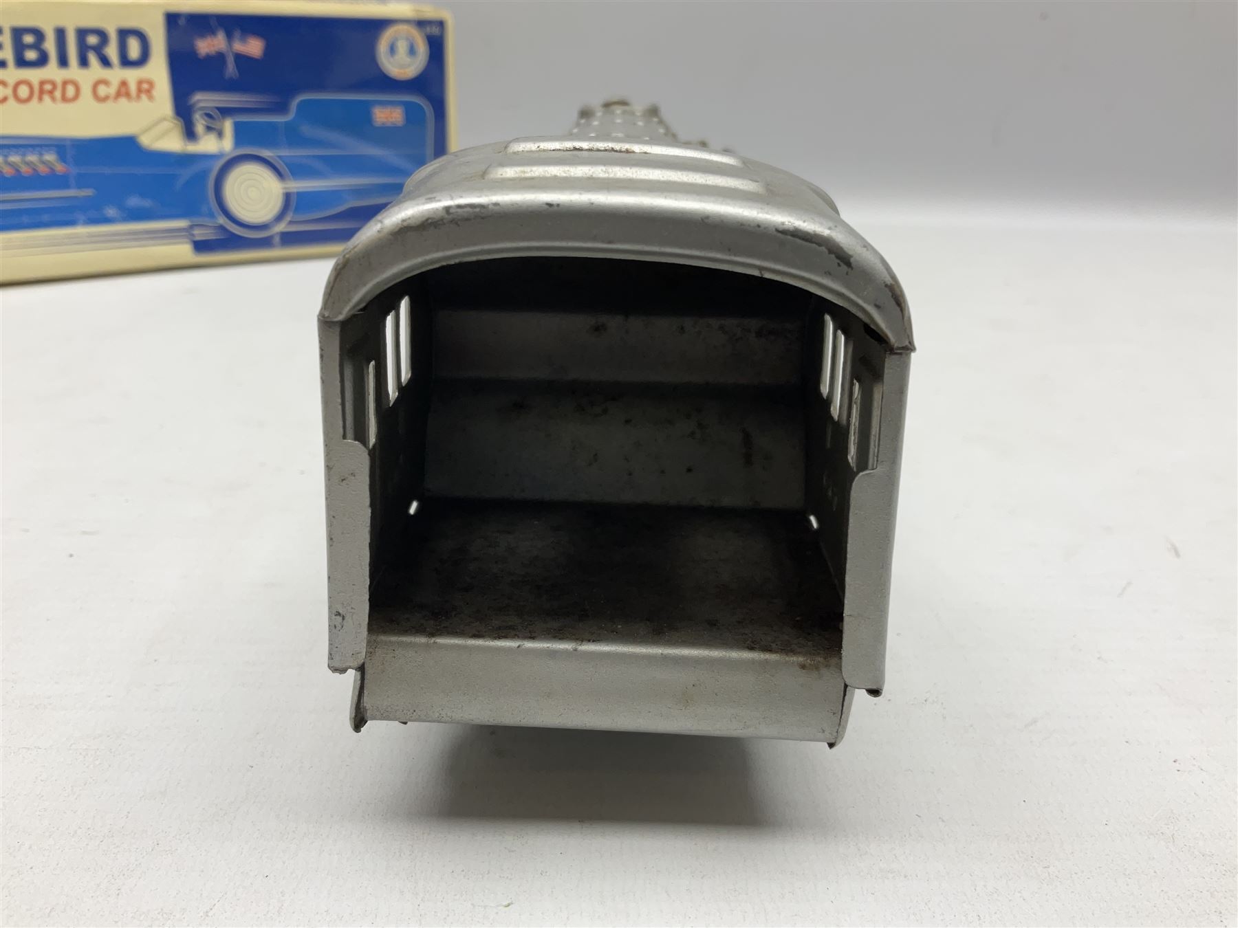 Schylling Collector Series clockwork tin-plate Sir Ian's Bluebird Land Speed Record Car with key and paperwork No.006080; boxed; and clockwork silvered tin-plate model of an 0-6-0 locomotive; unboxed (2)