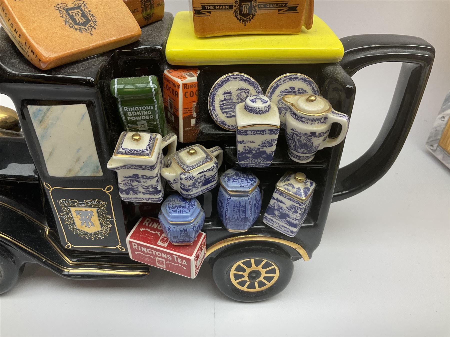 Ringtons novelty teapots, comprising the Ringtons Delivery Van teapot, and the Tea Merchant teapot, both with boxes and certificates of ownership.