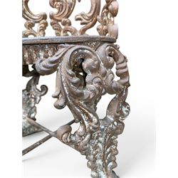 19th century Rococo Revival cast iron garden chair, pierced back comprised of scrolling acanthus leaves, over a pierced geometric white painted drop-in seat, raised on four acanthus and anthemion shaped cabriole supports united by X-frame stretcher