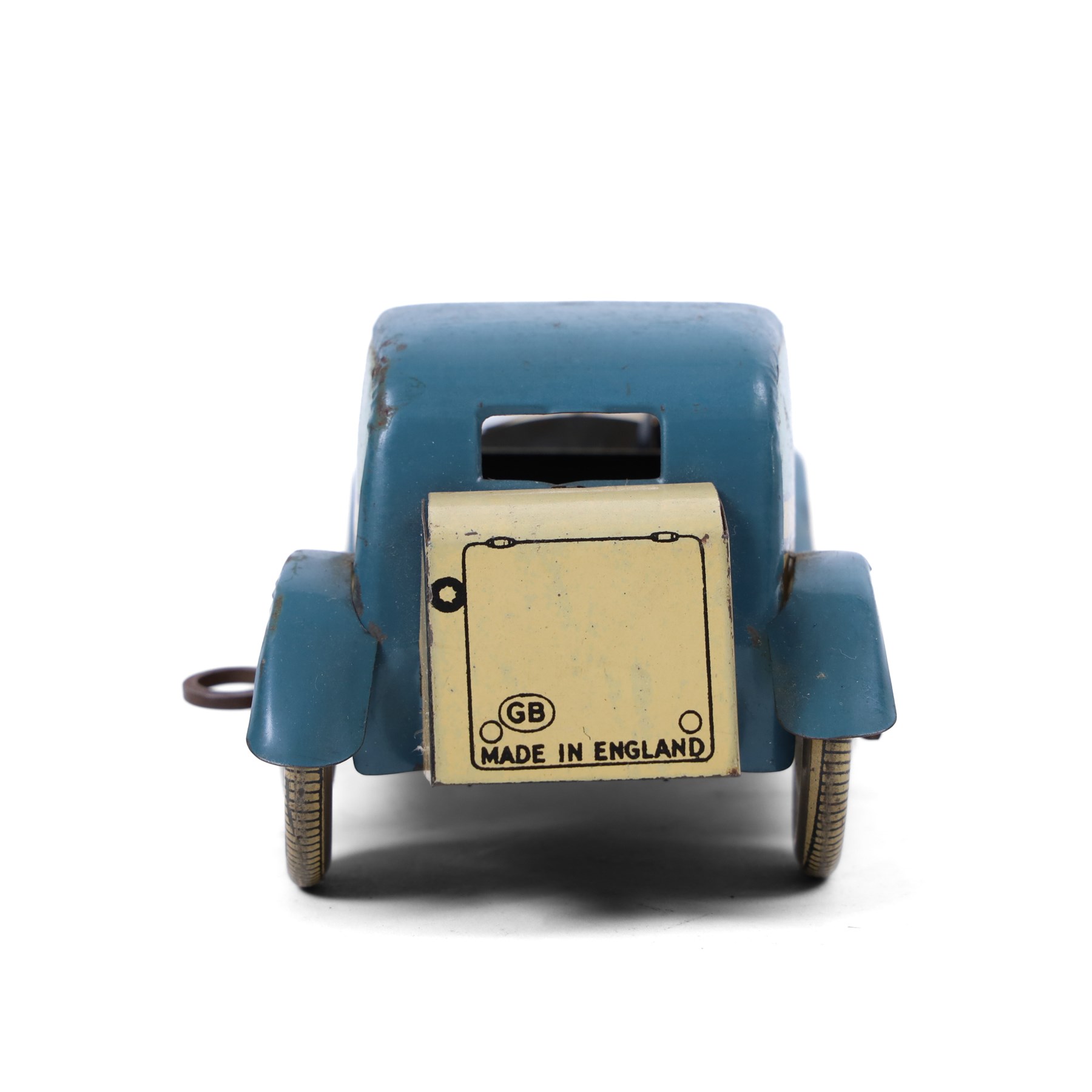 Wells tinplate clockwork limousine, the cream body, with blue roof and lithographed details, with driver and key, H8cm, L23cm