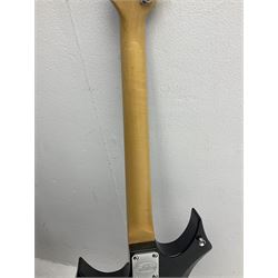 Stagg heavy metal style six-string electric guitar, finished in black with chrome tuning pegs, fret markers and humbucker pickups to bridge L106cm; and Hondo USA electric guitar with black body, ivory coloured pickguard and mother-of-pearl fretmarkers L101cm (2)   