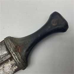 Eastern Jambiya, the 19cm double edge steel blade with raised medial ridge, waisted horn grip with pique work and white metal band; in stitched leather scabbard L33cm overall
