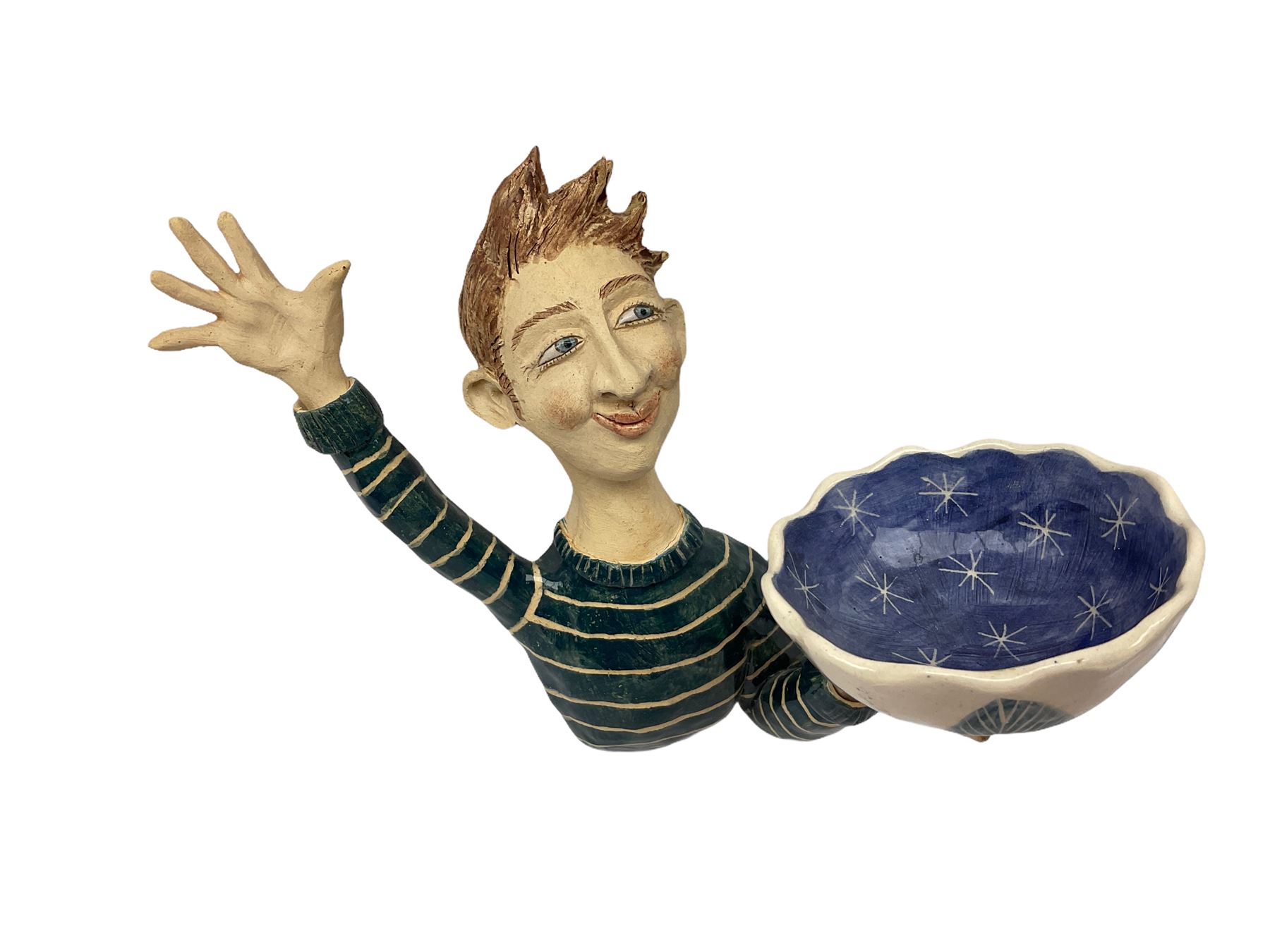 Ceramic 'girl and boy dish', by Helen Kemp, an oval dish with a mottled pink ground and gilt edging upon the sculpted heads of a girl and a boy, together with a 'boy sconce', by Helen Kemp, a sculpted boy holding a small bowl with foliate decoration, both with the artist's mark beneath.