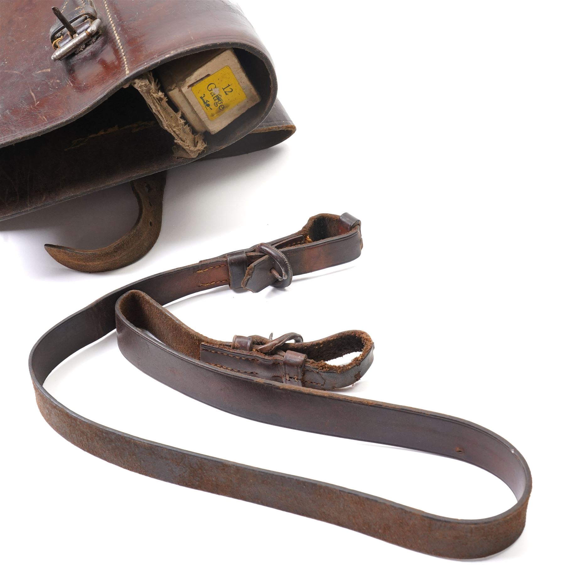 Leg of mutton leather shotgun case L78cm and a North African brass and horn powder horn