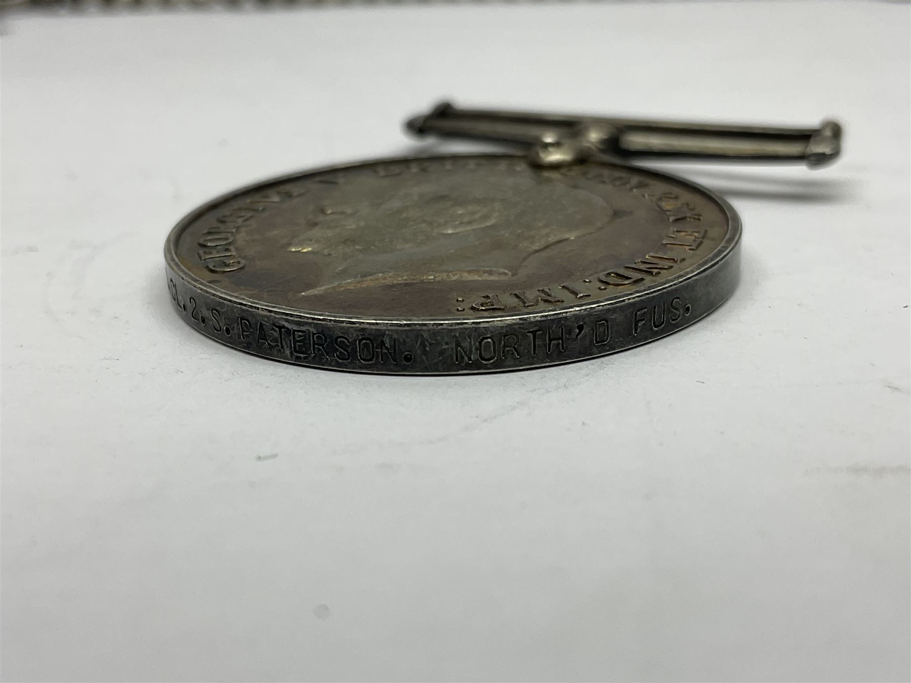 WW1 group of three medals comprising 1914-15 Star awarded to L-Cpl. W.J. Horspool R.War.R., British War Medal and Victory Medal awarded to A. Cpl. W.J. Horspool R.War.R.; WW1 British War Medal awarded to 3-8755 W.O.Cl.2. S. Paterson North'd Fus.; and hallmarked silver and enamel Northumberland Football Association Junior Cup Runners Up fob 1921-22 on silver chain (5)