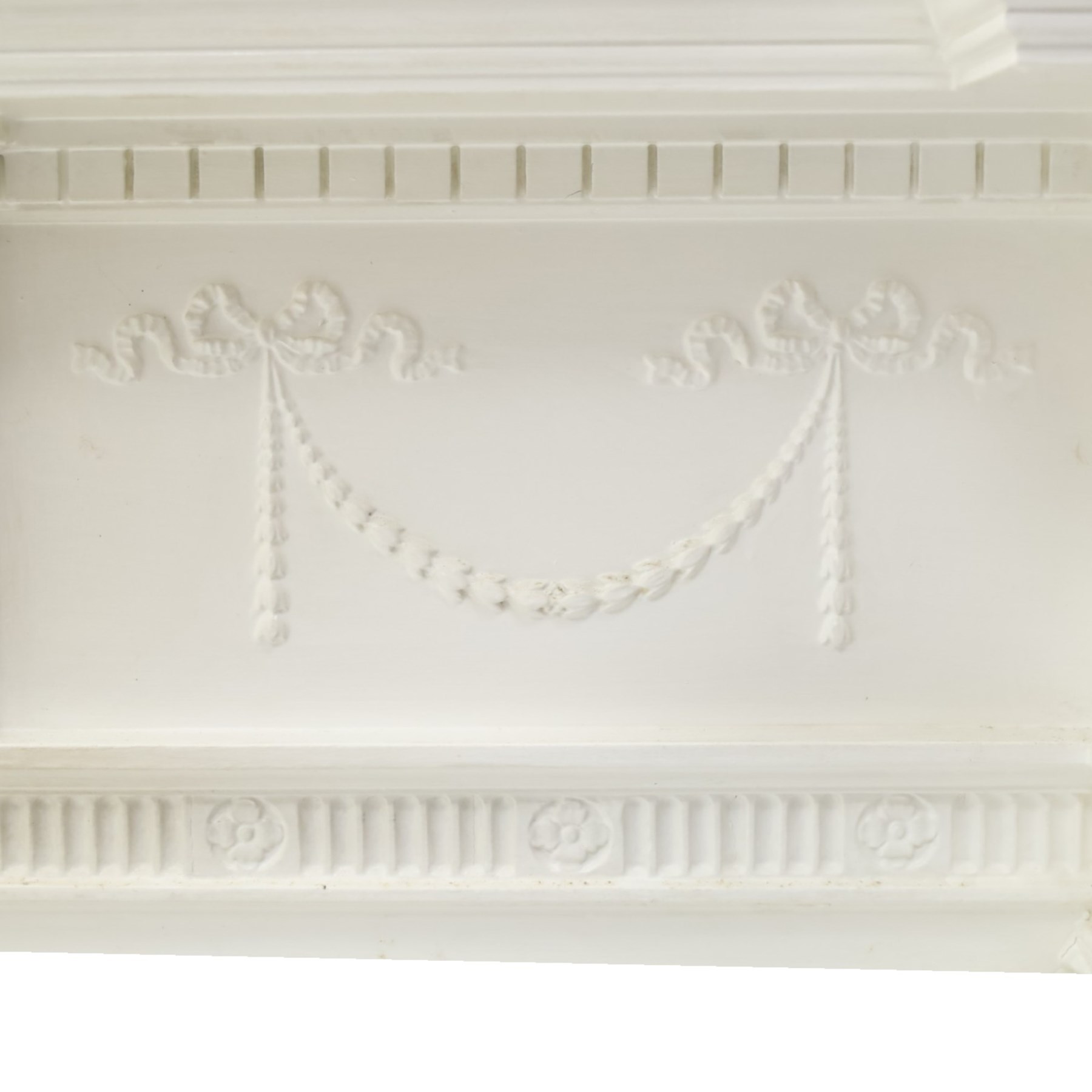 Large Adam's design white painted Neoclassical fire surround, the frieze moulded with goddess and cherubic motifs with bellflower festoons, egg-and-dart moulded inner slip flanked by Ionic capitals on classical columns