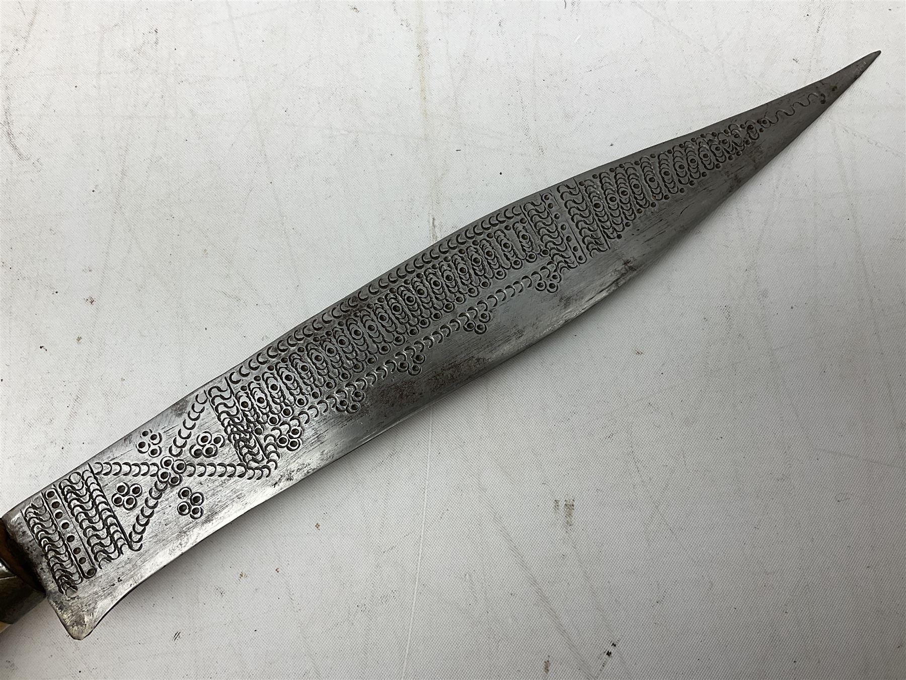 African tribal knife, possibly Shona Zimbabwe, the 22cm steel blade with all over punched decoration and antler handle; in inlaid and banded hardwood scabbard with two apertures L42cm overall