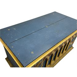 In the manner of William Burges - mid-to-late 19th century English Gothic Revival pine altar or console table, in blue and red paint with water gilding, the moulded rectangular top over six pointed arches with turned column supports, the front carved with a single row of lozenges and incised stylised motifs