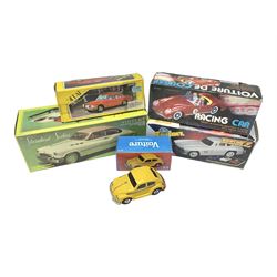 Five tin-plate model cars comprising MF326 Sedan Benz 1956, MF322 Standard Sedan in pink and white, MF763 Voiture de Course red racing car, MF264 Sedan and MF146 Sedan VW Beetle in yellow; all in original boxes 