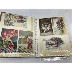 Quantity of Victorian and later postcards, including silk embroidered, coloured illustration, comical and photographical examples, housed in two albums