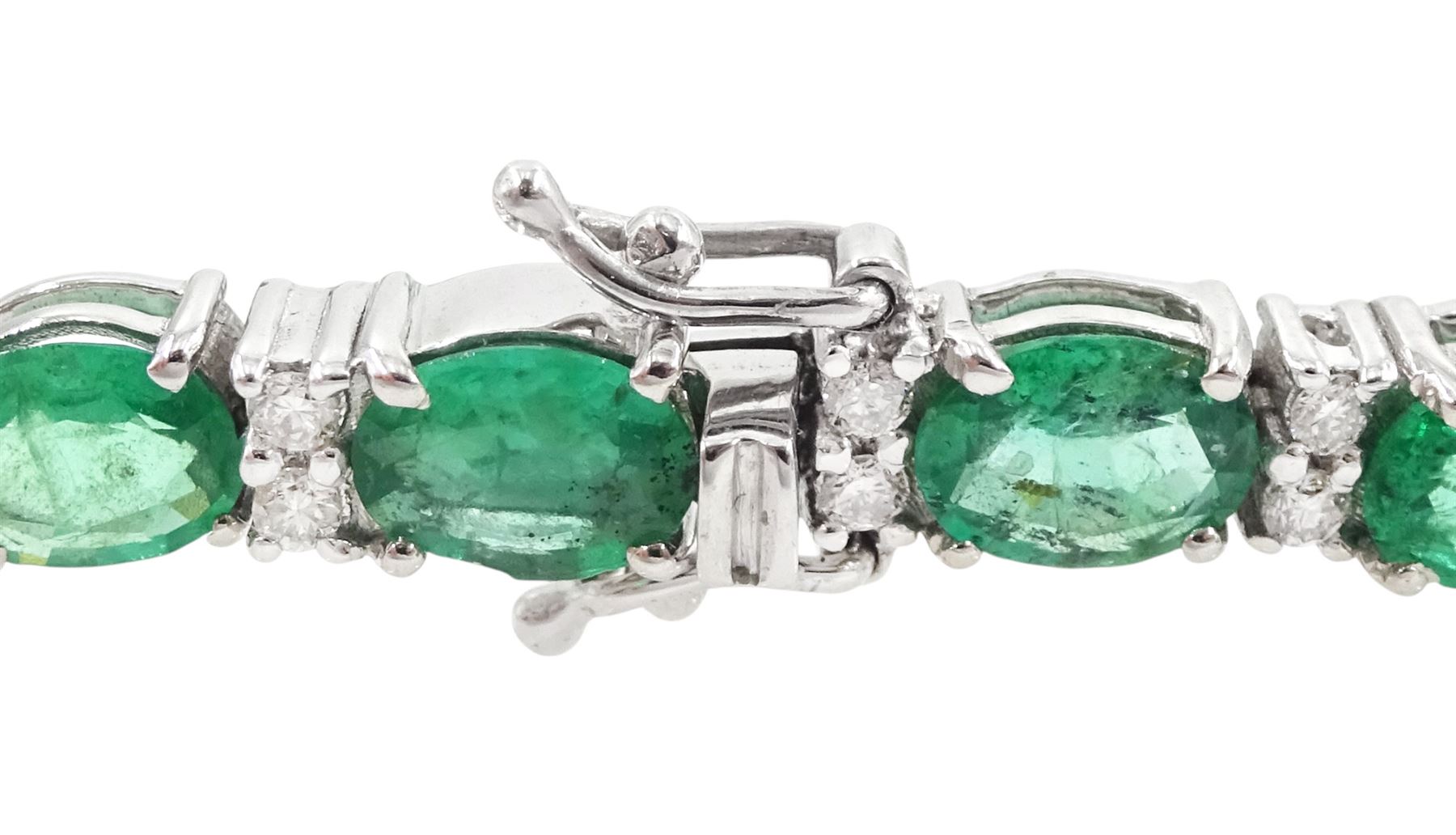 18ct white gold oval cut emerald and round brilliant cut diamond bracelet, stamped, total emerald weight 7.45 carat, total diamond weight 0.48 carat