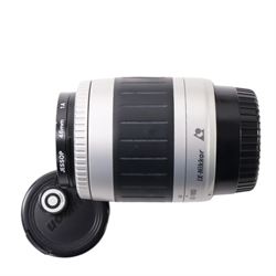 Eight camera lenses, comprising Canon Ultrasonic Zoom EF 75-300mm 1:4-5.6 lens, AF Nikkor 35-70mm 1:3.3-4.5 lens, Nikkor 60-180mm 1:4.5-5.6 lens, Canon Zoom EF 28-80mm 1:3.5-5.6 lens, Canon Zoom EF 80-200mm 1:4.5-5.6 lens, Sigma 70-300mm 1:4.6-5.6 DL Macro, Sigma Zoom 70-210mm 1:4-5.6 UCII lens and a Sigma AF 70-300mm 1:4-5.6 APO Macro lens, all with lens caps