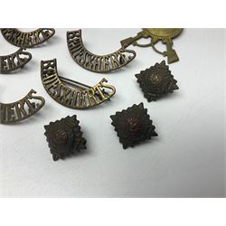 Over thirty British and Continental military metal badges; together with quantity of shoulder titles, collar dogs, rank pips, uniform buttons etc