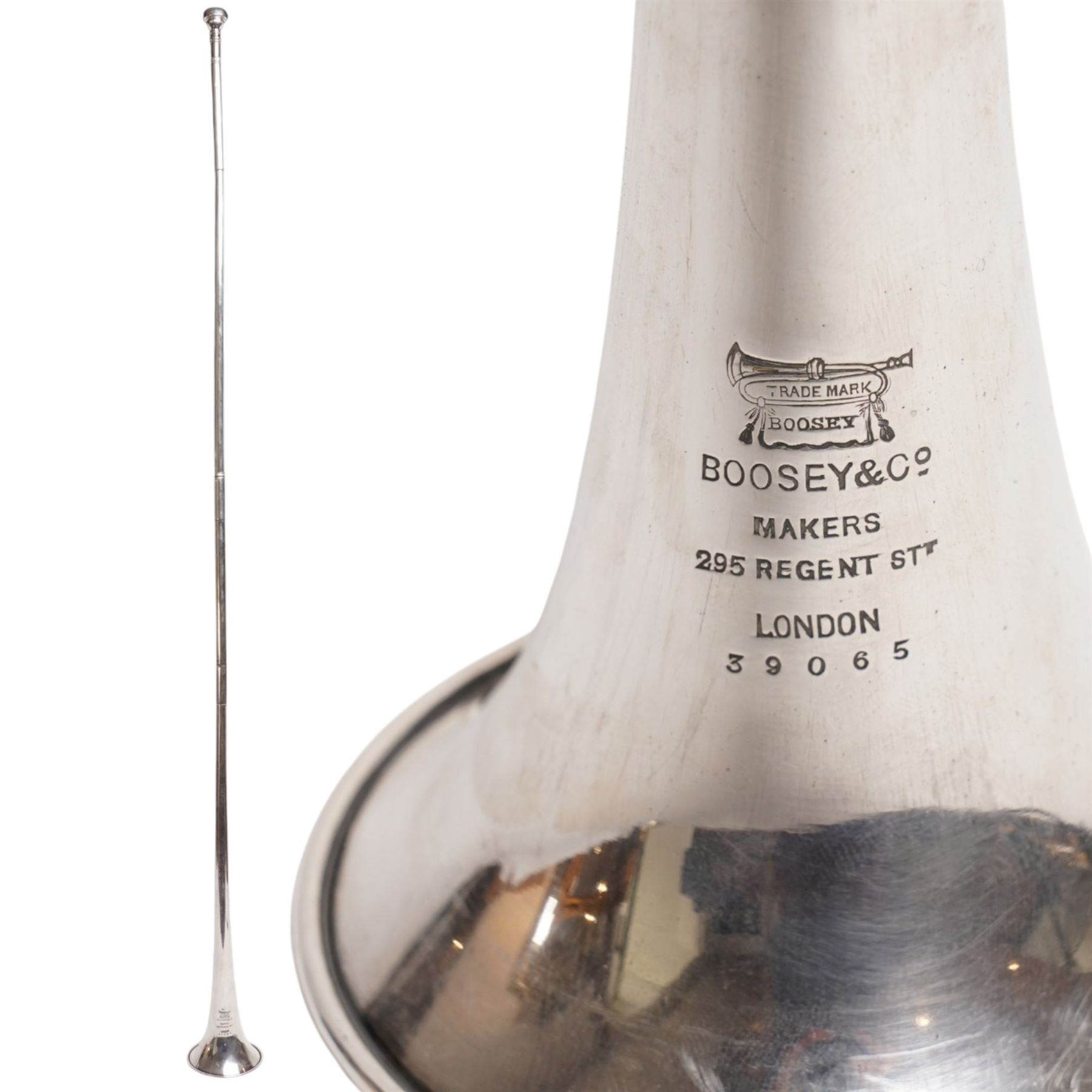 Boosey & Co. (295 Regent Street London) - Late Victorian silver plated sectional coaching horn of tapering form with flared bell, the mouthpiece stamped Vincent Bach Corp 7C surmounting the long tube with two ferrules, stamped to the bell with serial no. 39065, L128cm; with associated leather sleeve case