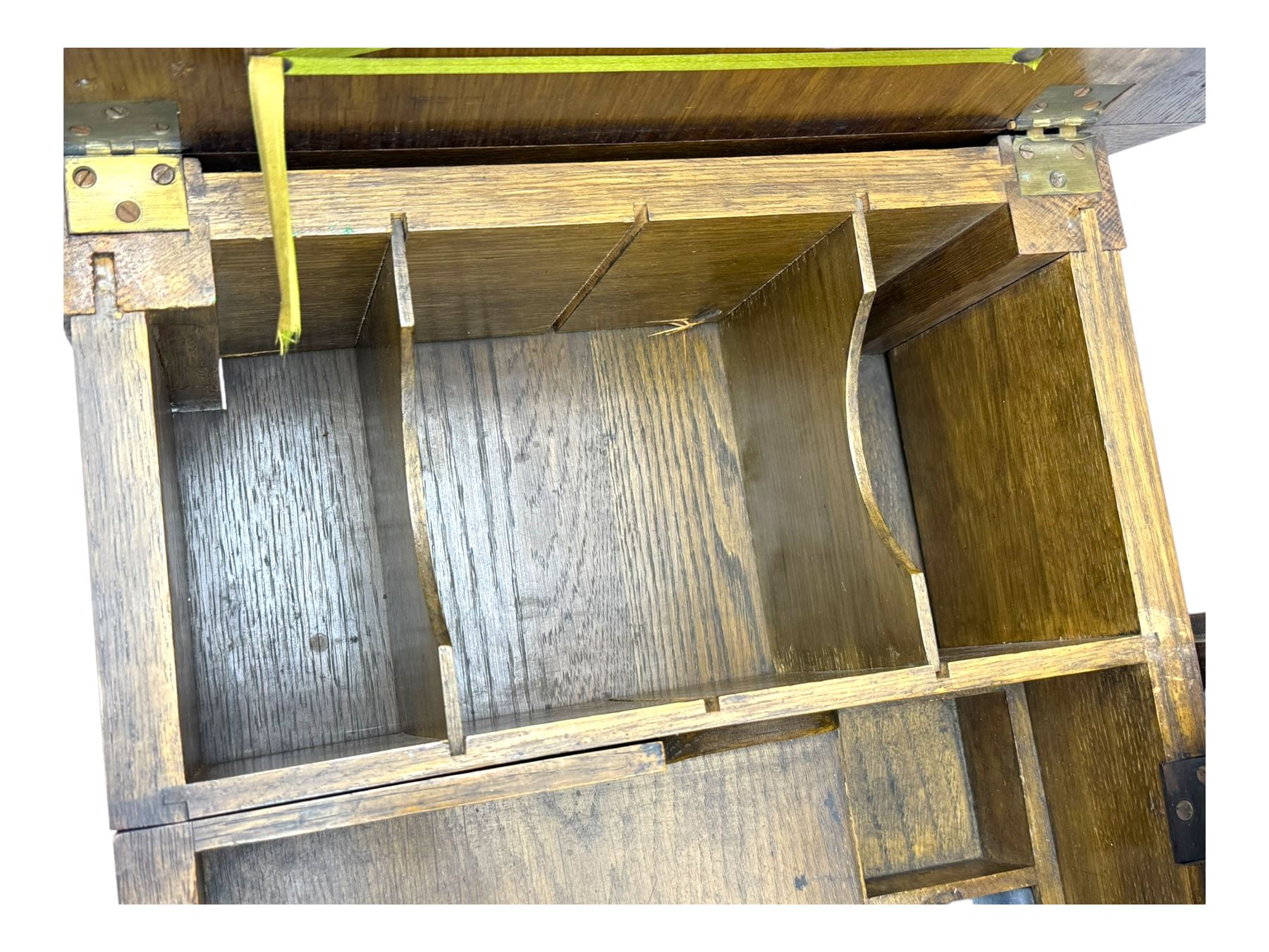 Edwardian oak metamorphic 'Britisher Writing Table', rectangular hinged top revealing correspondence compartments and hinged writing surface with underside storage, flanked by twin hinged compartments with dividers, on turned supports