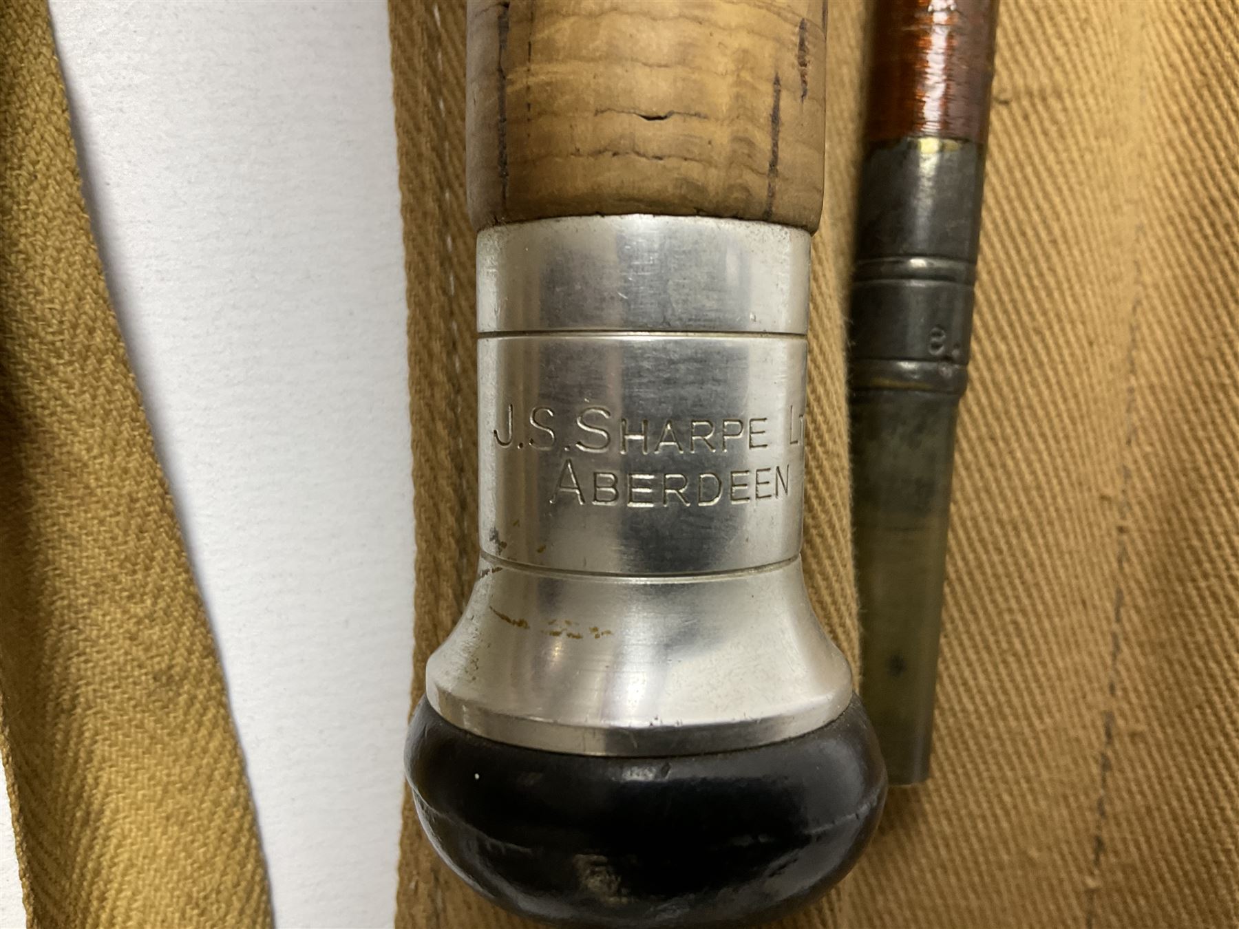 Four vintage split cane fishing rods in cloth bags, to include the Scottie Impregnated JS Sharpe rod and Pezon et Michel Farlow rod (4)