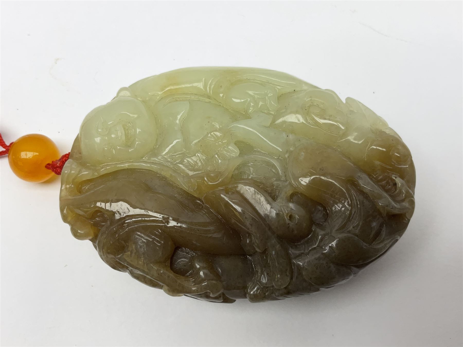 Chinese hardstone carving of a fish amongst coral, with platted rope handle, together with other hardstone and soft stone carvings  