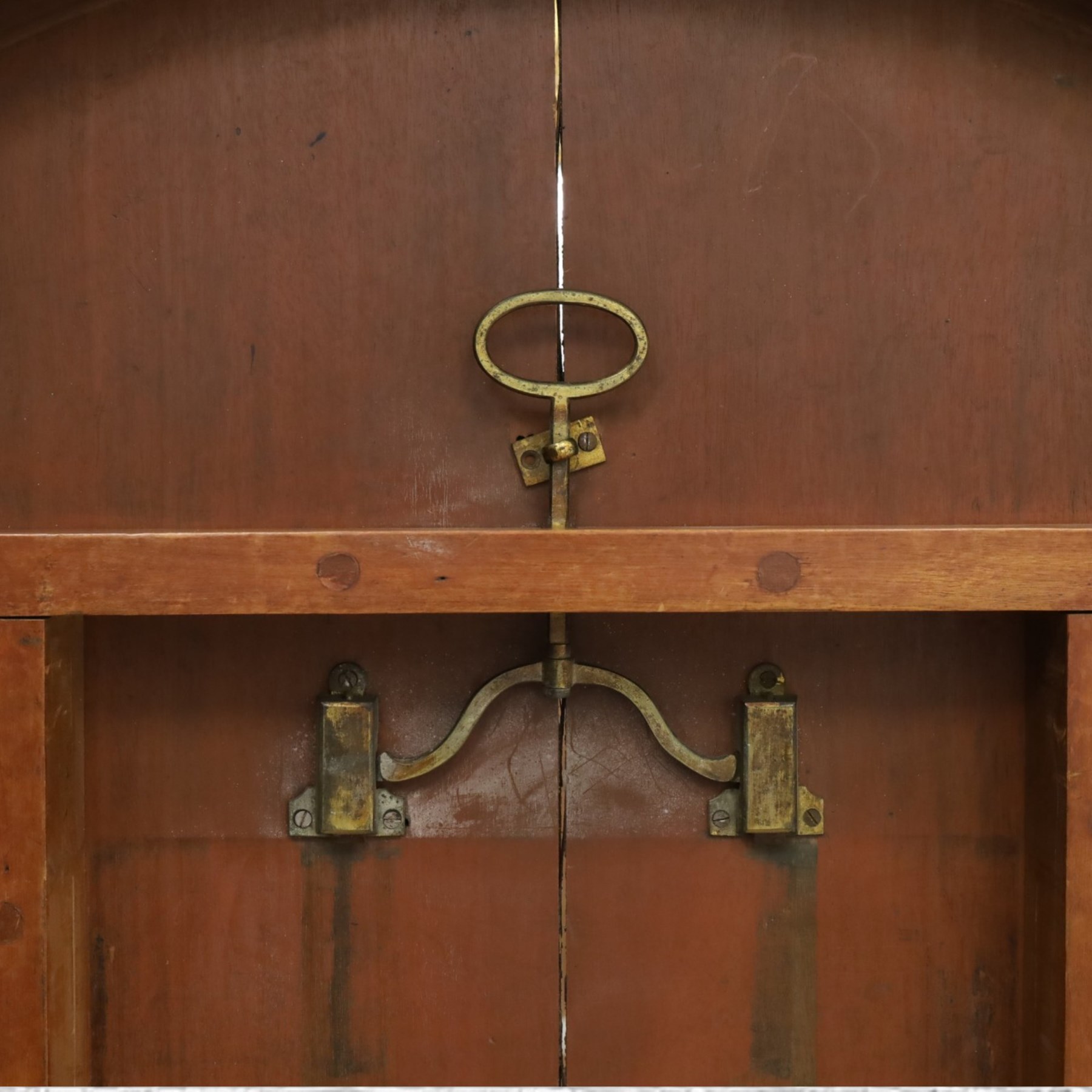 William IV mahogany circular breakfast table, banded frieze over a turned decagon pedestal with lappet carved collar, terminating to a triform platform base with scroll feet and castors