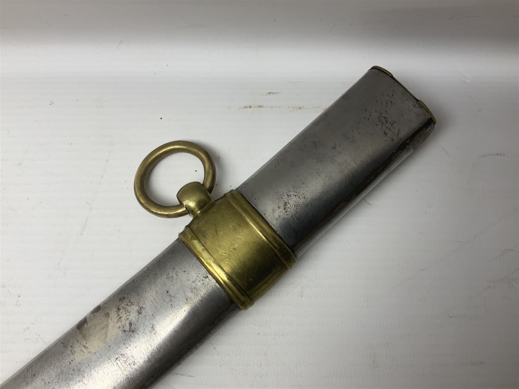 Early 19th century French Lancers officer's sword c1810, the 84cm curving fullered blade retaining most of its bluing, gilding and engraved decoration, inscribed I.S.& C. to ricasso (for Schimelbusch), brass three-bar hilt with elongated elliptical langets and wire-bound leather grip; in polished steel scabbard with two brass suspension rings L100cm overall