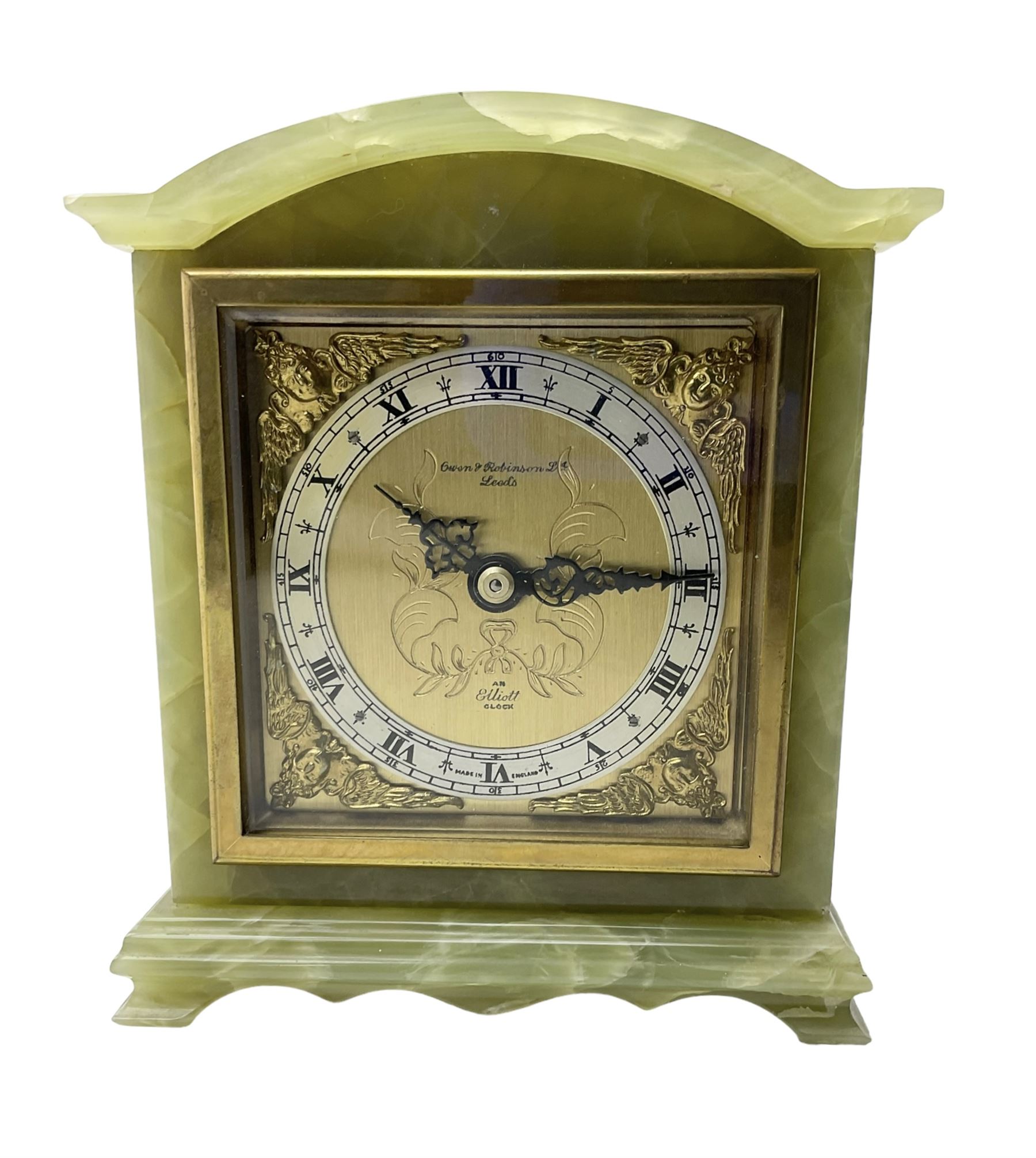 Elliot - English 20th century timepiece mantle clock in a green Onyx case, brass dial with spandrels, pierced steel hands, engraved centre and silvered chapter ring, retailed by Owen  & Robinson Leeds, integral key, wound and set from the rear.