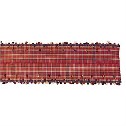 South West Persian Jajim kilim flatweave runner, composed of joined narrow woven bands,  field decorated with checked and striped motifs in shades of madder red, indigo, ivory ochre, and green, sides applied knotted wool tufts and braided elements with tasselled edges, (due to the large size, the runner is illustrated in two sections) 