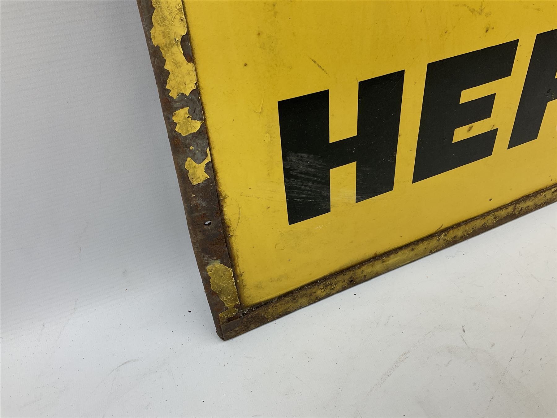 Enamel street advertising sign for The Manchester Guardian, with black lettering on yellow ground, H79cm W52cm