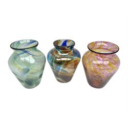 Three Hartley Wood coloured glass vases, each of baluster form with swirling decoration, tallest H21cm