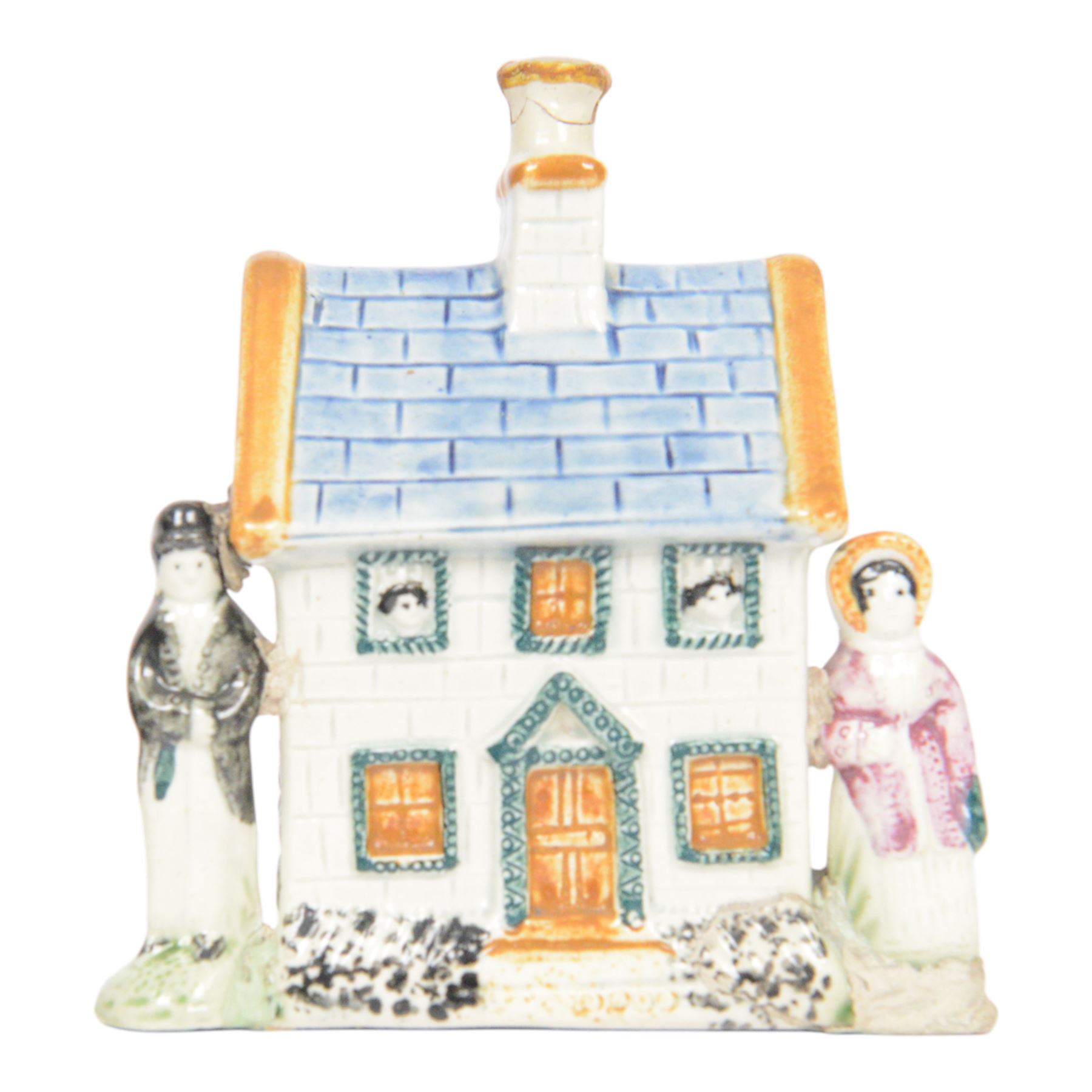 19th Century Staffordshire pearlware Prattware type money box, modelled as a houe with two figures to the front corners, H13cm