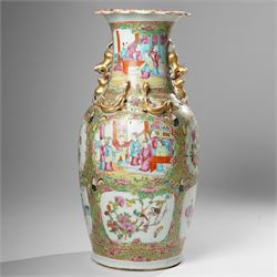 Cantonese famille rose vases, of inverted baluster form, the domed cover with gilt dog of Fu finial, H38cm; together with a further pair of Cantonese vases, each with double Buddhist lion handles and applied at the shoulders with chilong, H45cm (3)