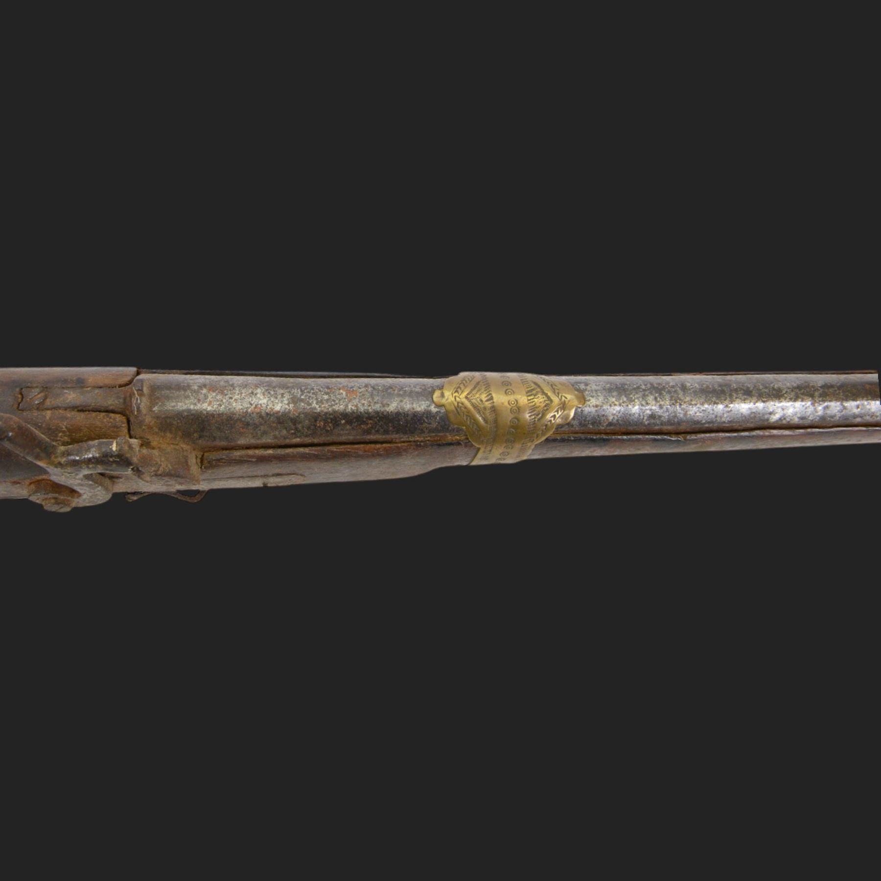 Middle Eastern percussion cap rifle, the 107cm  barrel with four brass bands and ramrod under, overall L143cm, together with another percussion rifle the 106cm barrel a copy of a 17th century Spanish barrel, complete with fake stamp, by vendors repute this rifle was confiscated from tribesmen in Kurdistan by police
Sold as an exempt item under Section 58 (2) of the 1968 Firearms Act, to be held as a curiosity or ornament