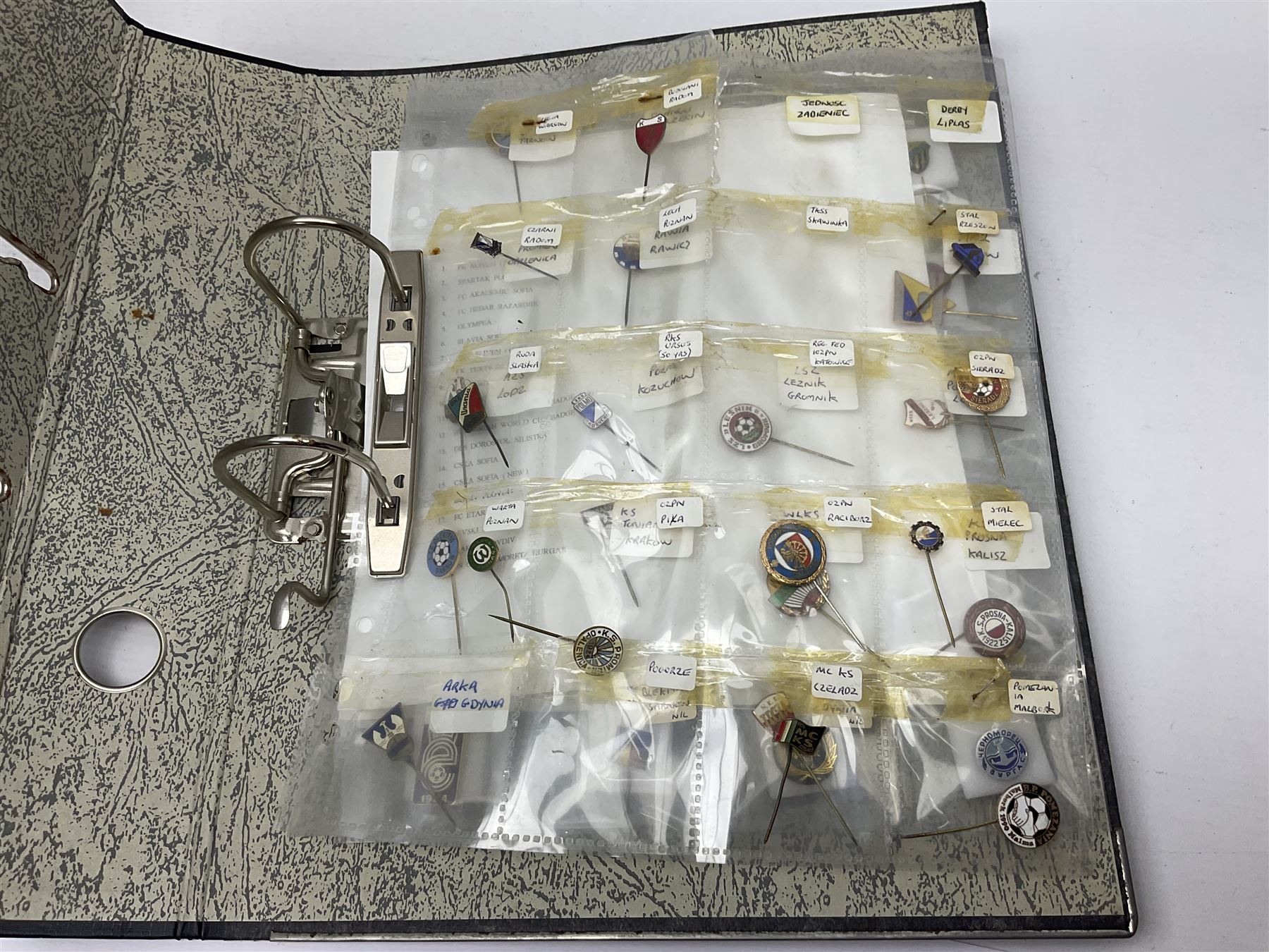 Large collection of approximately one hundred and eighty enamel badges and pins, relating to British and World football clubs, including loose examples and examples housed in folders, mostly identified