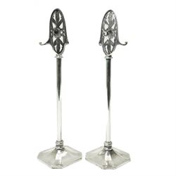 Pair of silver plated companion stands with pierced oval finials on square bases H53cm