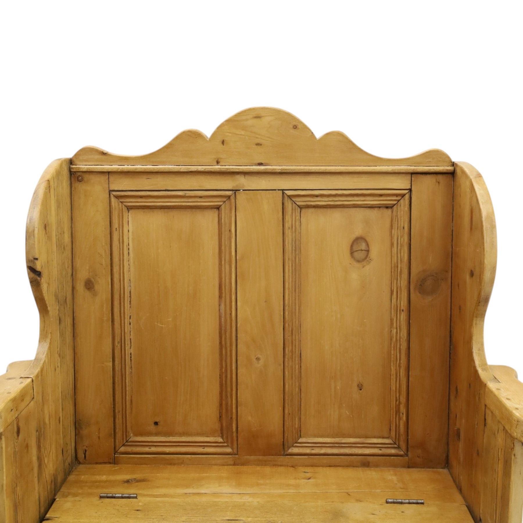 Victorian waxed pine settle or hall bench, shaped cresting rail over double panelled back, outswept arms on hinged box-seat, on end supports