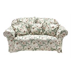 Early 20th century two seat settee with drop arm, upholstered in Sanderson 'Absalon Minor' fabric, loose covers and cushions, white ground with overall floral design