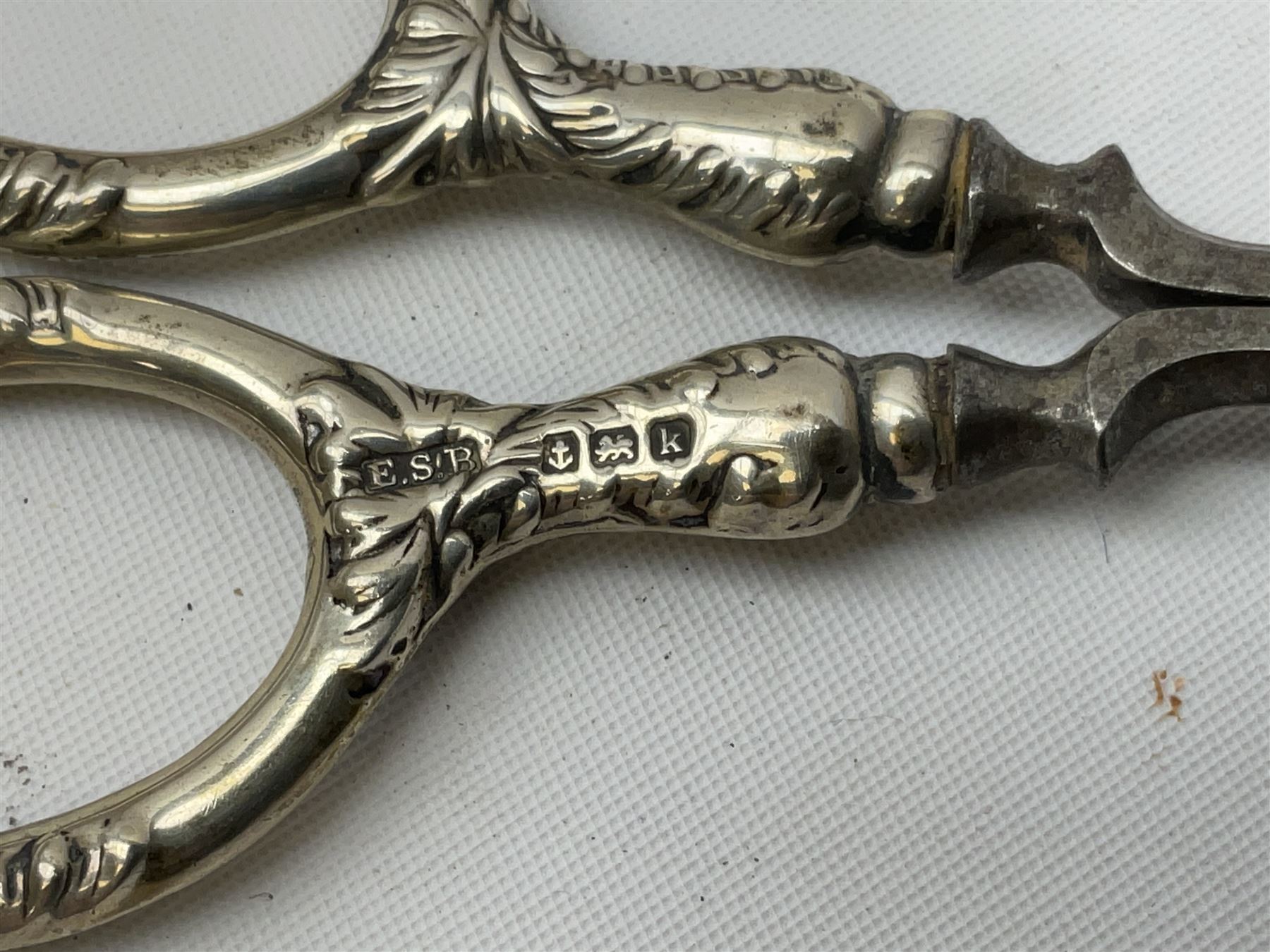 Small group of silver, to include Georgian Fiddle pattern teaspoon, later teaspoon, sugar tongs, etc., all hallmarked, approximate weighable silver 59 grams, approximate gross weight 113 grams