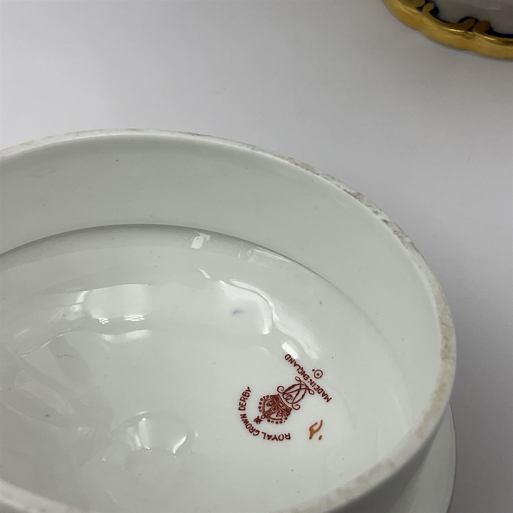 Early 20th century Royal Crown Derby teapot, decorated in a variant of the Imari pattern with blue and red prunus blossoms, with printed mark beneath including illustration date code for 1927, H14cm
