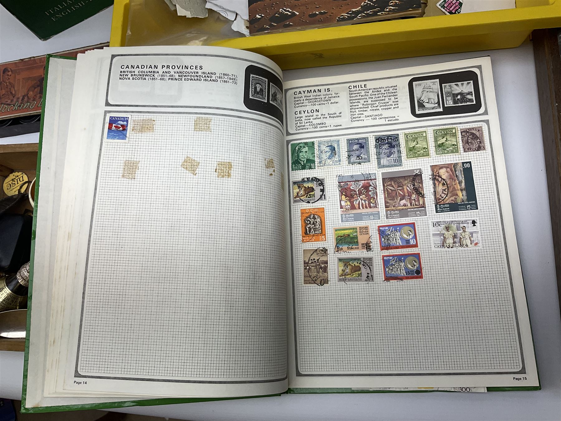 Collection of whimsy figures in a wooden display case, together with other assorted collectables, including stamps, pin badges etc