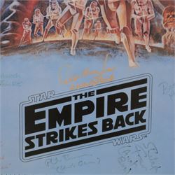 Autographed 1980s Star Wars Empire Strikes Back movie poster, with artwork by Tom Jung, with signatures including Michael Sheard (Admiral Ozzel), Koo Stark, Caroline Blakiston (Mon Mothma), Shelagh Fraser (Aunt Beru), Mike Edmonds (Logray), Peter Mayhew (Chewbacca), Jeremy Bulloch (Boba Fett), Stuart Freeborn (Creature Designer), Warwick Davies (Wicket), Michael Carter (Bib Fortuna), Dave Prowse (Darth Vader), Kenny Baker (R2D2), signatures and poster obtained at the Dave Prowse Promotions Mulitcon Event 1998 at The Norbreck Caste Hotel, Blackpool, in glazed black frame, frame H115cm