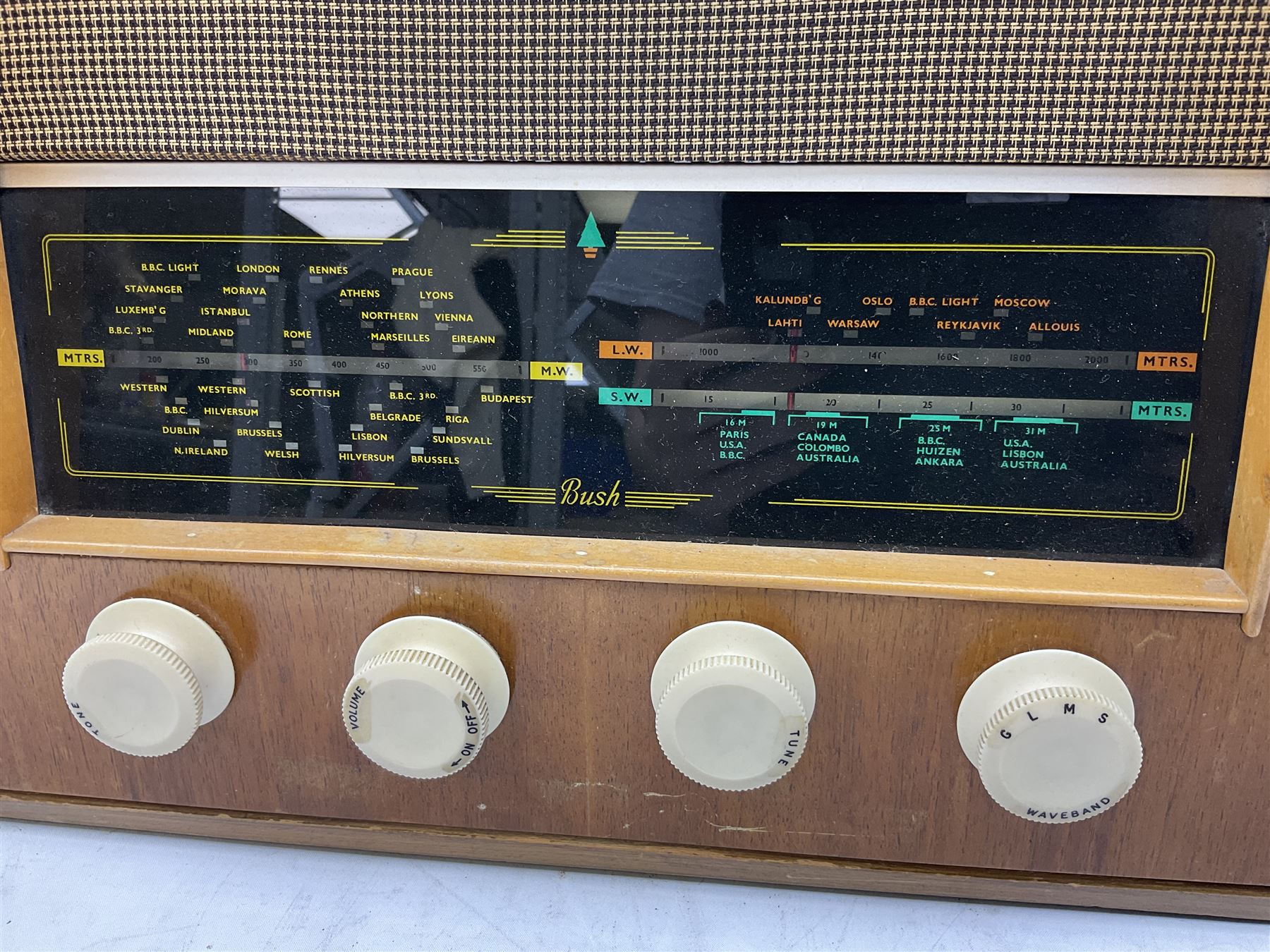 1950s Bush AC41 mahogany cased valve radio, 1930s Philips 588A with walnut veneer case, and 1940s Cossor Model 77, tallest H47cm W36cm D24cm