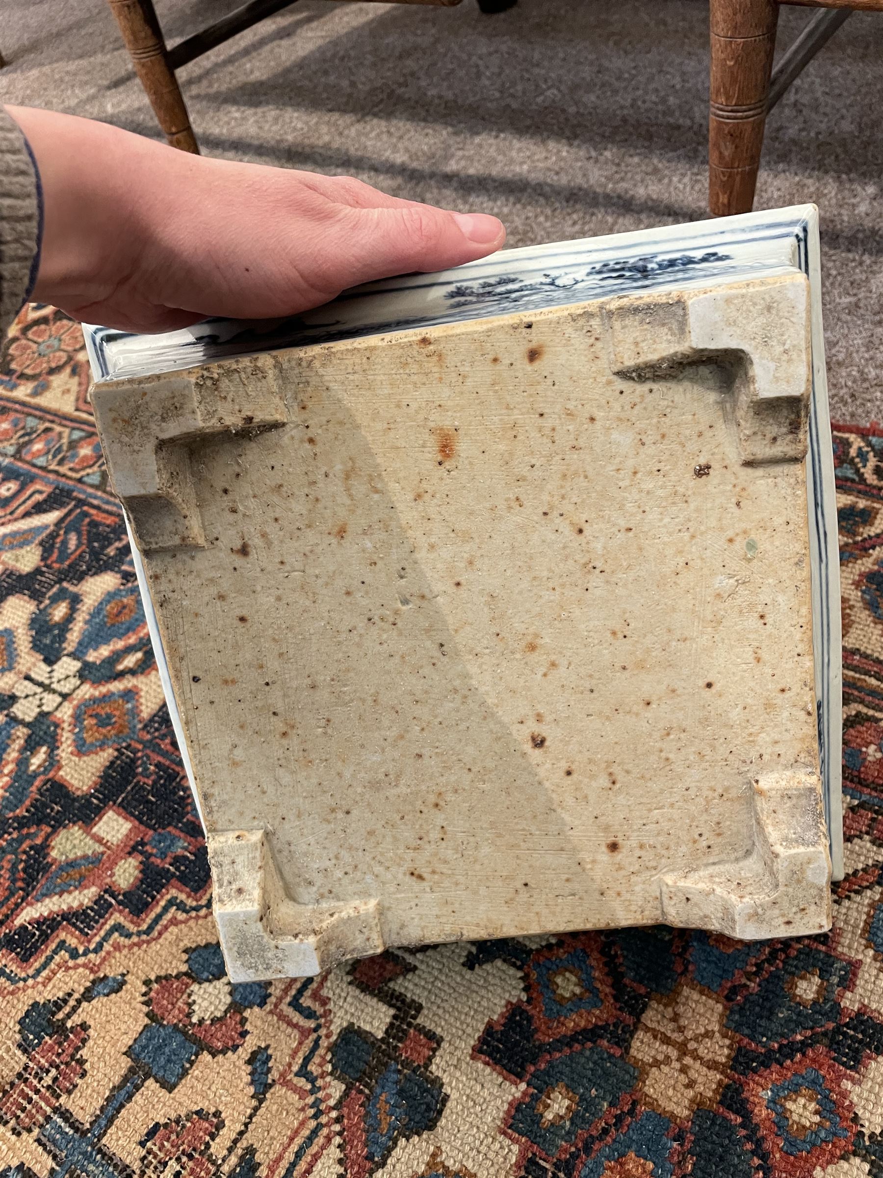 19th century Chinese blue and white planter and stand, each of square slightly tapering and flared form, the planter decorated with figures and precious objects between stylised foliate borders, the stand decorated with landscapes beneath a lipped rim with cell band, planter H28cm D25.5cm, stand H7cm D26cm