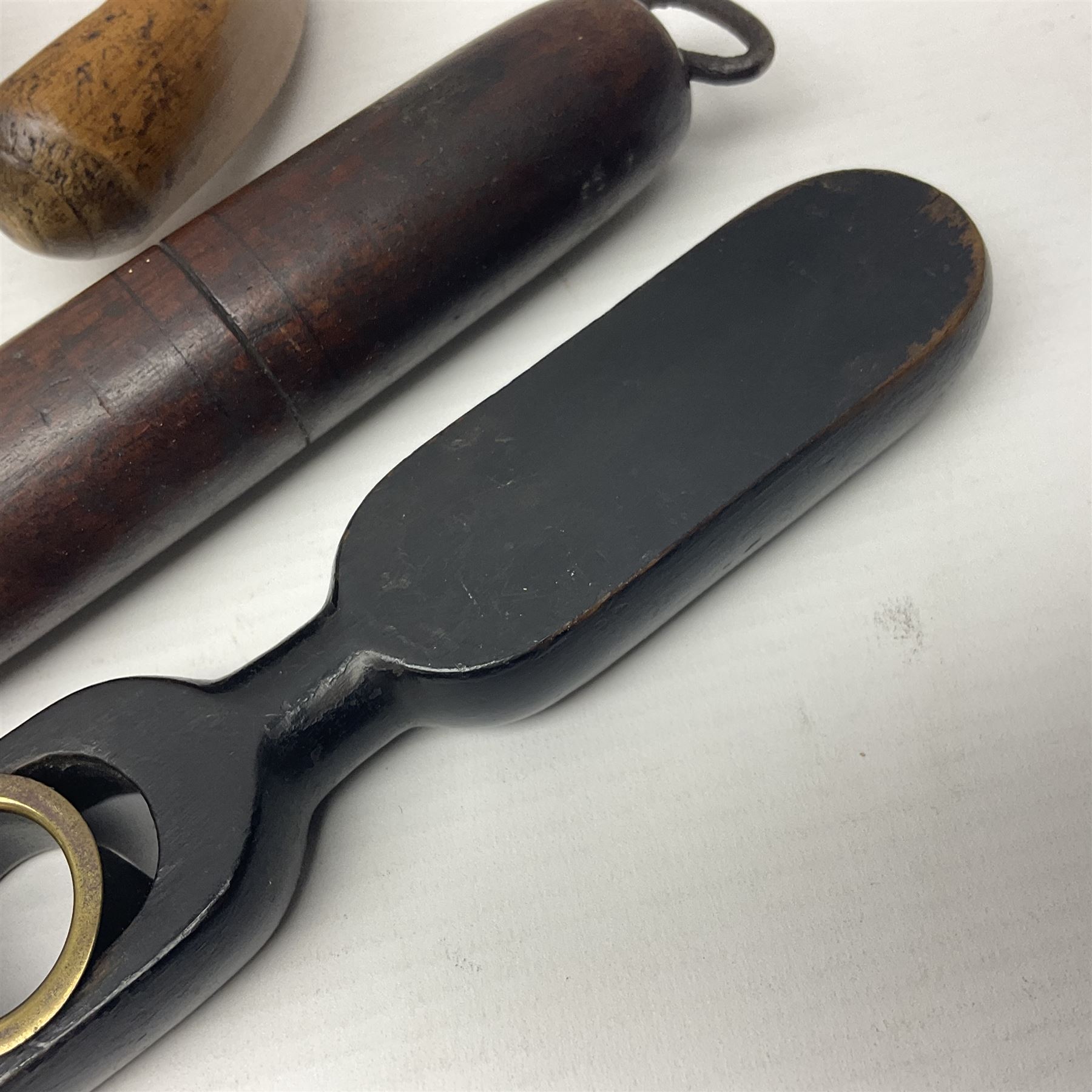Two late 19th century fruit picker canes, the first example a French ebonised bamboo cane, with pair of fruit scissors to base, the handle stamped Cueille Fruit, the second example with grabbing action, the cap stamped A C Harris, Leicester, together with two other 19th century canes, one with fork and the other with hoe