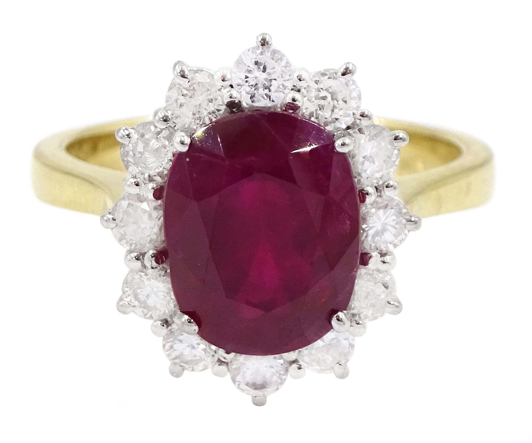 18ct gold oval cut ruby and round brilliant cut diamond cluster ring, hallmarked, ruby approx 3.40 carat, total diamond weight approx 0.65 carat