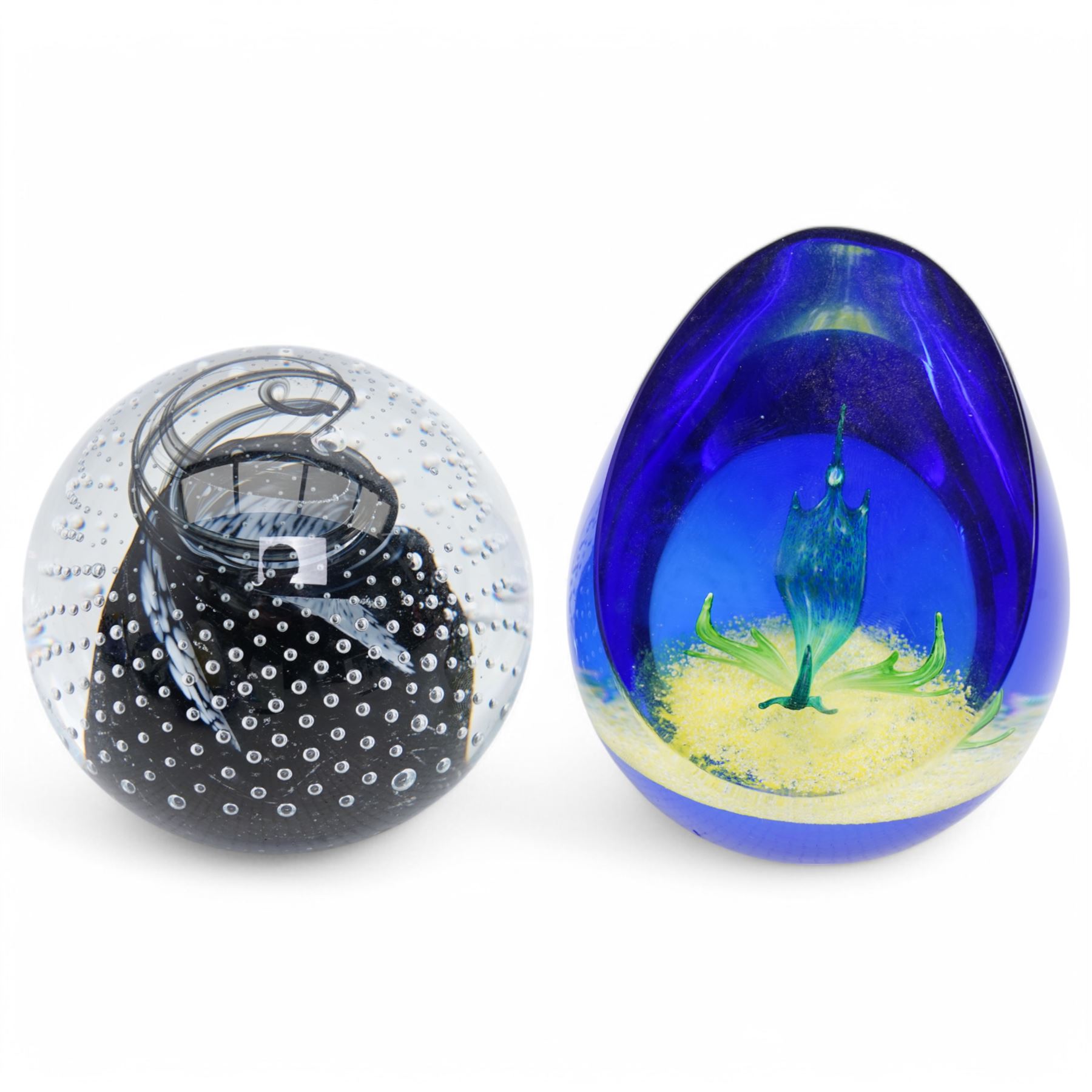 Caithness 'Shifting Sands' and 'Cauldron' glass paperweights, together with a Murano style glass duck, various other paperweights including millefiori and tomato example (12)