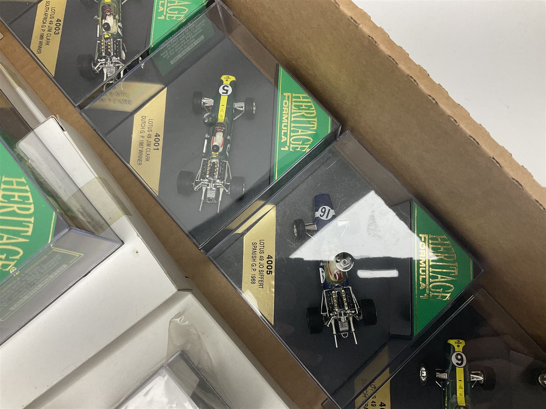 Heritage - thirty-five die-cast model racing cars comprising twenty-five Heritage Formula 1 1:43 scale models including Ferrari, Lotus, Yamaha etc; and ten Special Edition models including Williams Renault Ayrton Senna, David Coulthard and IndyCar, etc with certificates; and a Heritage Classics Damon Hill helmet; all in display boxes, many with original packaging (36)