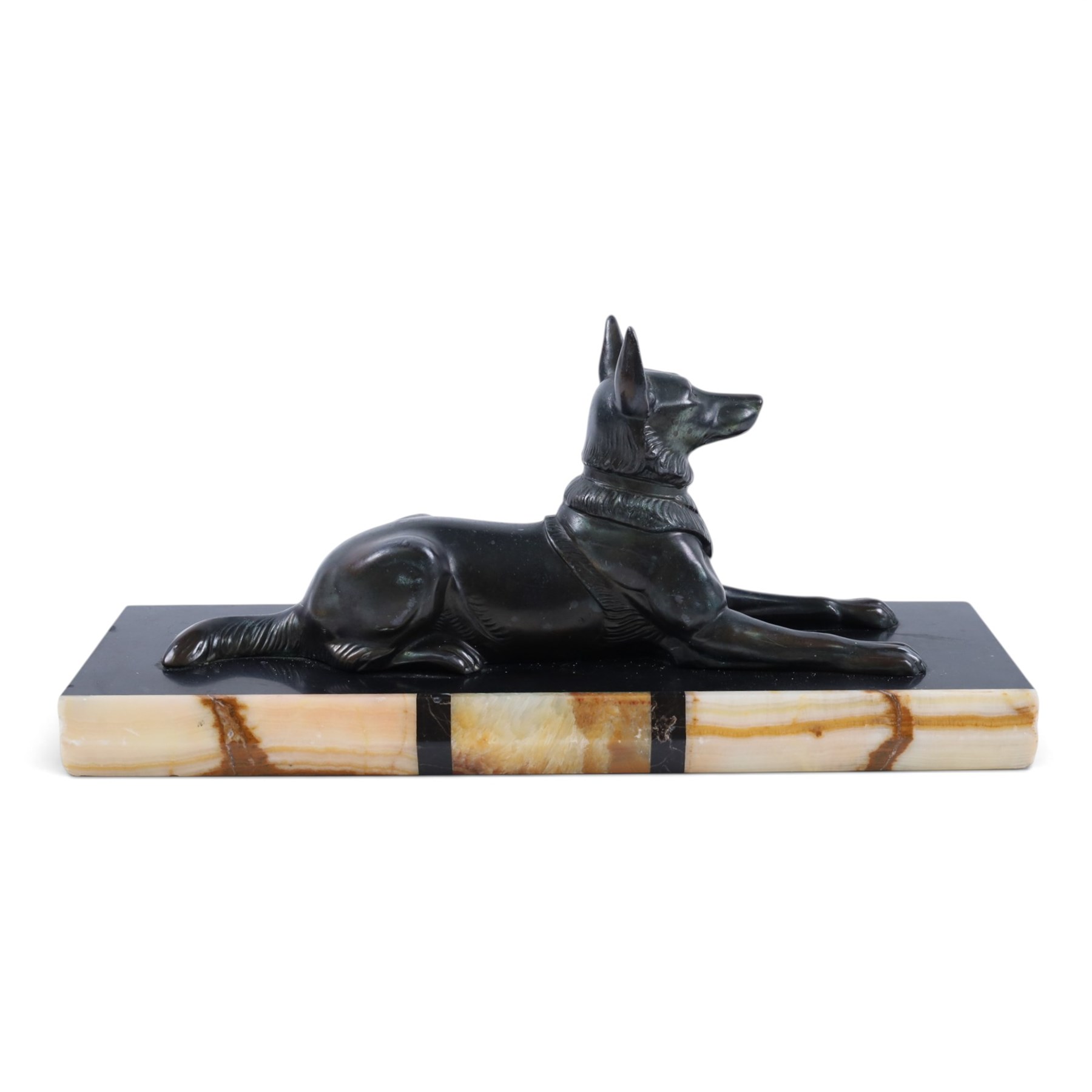 French Art Deco spelter figure of a recumbent dog on marble and onyx plinth, H14cm, L30cm