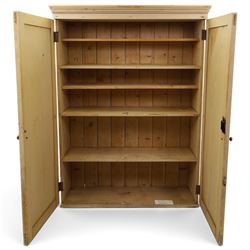 19th century stripped pine linen cupboard, projecting cornice over two panelled doors enclosing five assorted shelves
