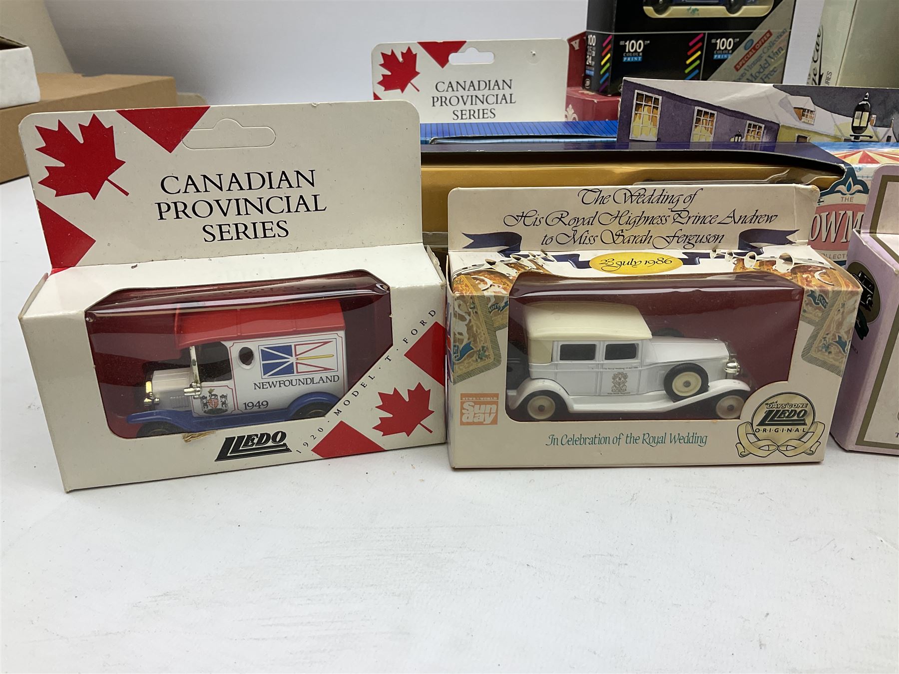Collection of Diecast model vehicles, including Lledo The Golden Days of the Film Industry limited edition set, Lledo H Samuel boxed vehicle, and other similar examples 