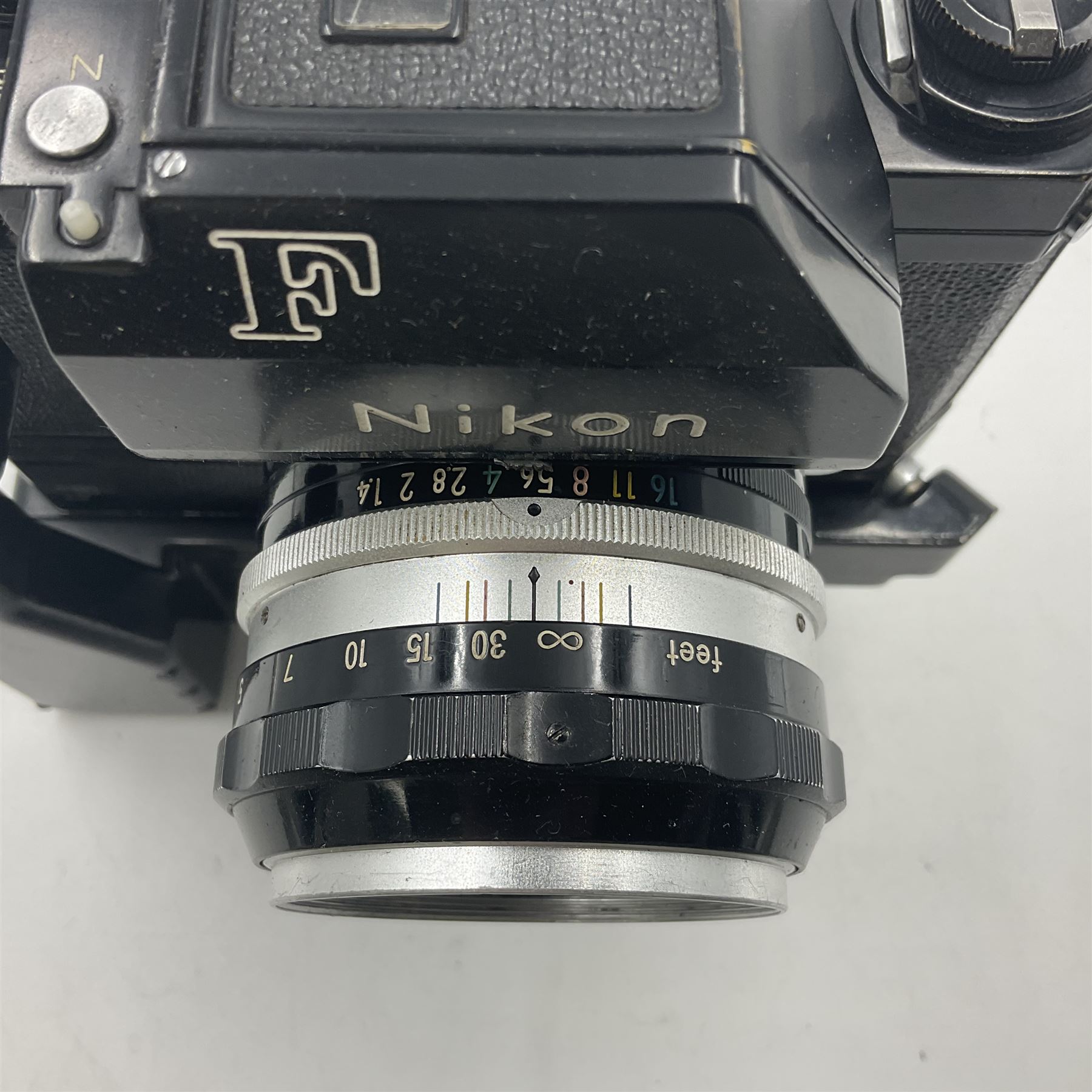 Nikon Photomic TN NKJ camera body, serial no 6728309, circa 1965, with 'Nippon Kogaku NIKKOR-S Auto 1:1.4 f=5.8cm' lens, serial no. 173909, Nikon F36 Motor Drive, serial no.132430 and Nikon cordless battery pack